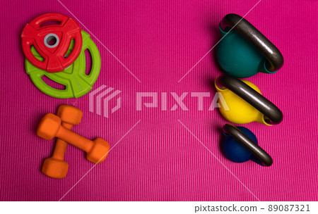 Sport weight rod red dumbbells yellow blue green barbell, concept healthy lifestyle gym lifestyle from workout for room towel, trainer lifting. Muscular floor build, 89087321