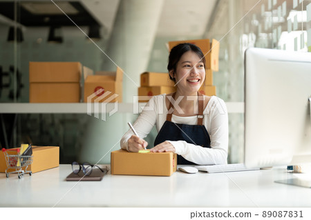 Starting Small business entrepreneur freelance, Portrait young asian woman working at home office with computer, online, marketing, packaging, delivery, SME, e-commerce concept Starting Small business entrepreneur freelance, Portrait young asian woman working at home office with computer, online, marketing, packaging, delivery, SME, e-commerce concept 89087831