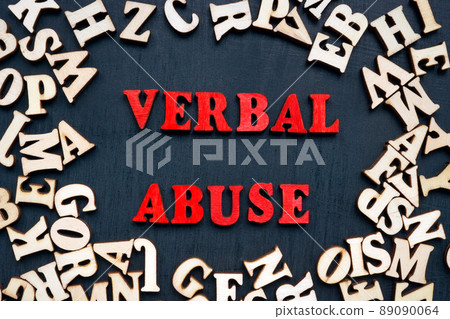 Words verbal abuse and wooden letters around. Words verbal abuse and wooden letters around. 89090064