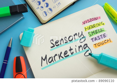 Open notepad and marks about Sensory marketing. Open notepad and marks about Sensory marketing. 89090110