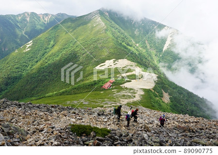 Climbers on the mountain trail towards the Jonen Pass and the Jonen Hut Climbers on the mountain trail towards the Jonen Pass and the Jonen Hut 89090775
