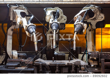 Robots welding team in the automotive parts industry 89092602