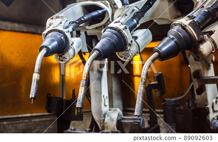 Robots welding team in the automotive parts industry 89092603