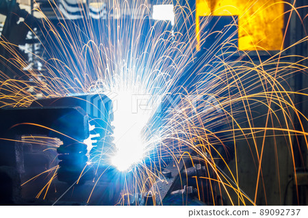 Welding robots movement in a car factory Welding robots movement in a car factory 89092737
