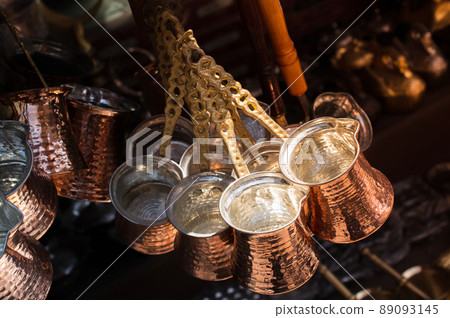 Traditional Turkish coffee pots, cezve made in a traditional style. Traditional Turkish coffee pots, cezve made in a traditional style. 89093145