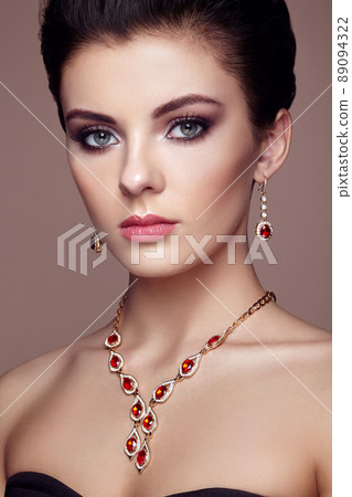Fashion portrait of young beautiful woman with jewelry Fashion portrait of young beautiful woman with jewelry 89094322