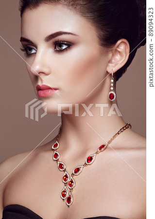 Fashion portrait of young beautiful woman with jewelry Fashion portrait of young beautiful woman with jewelry 89094323