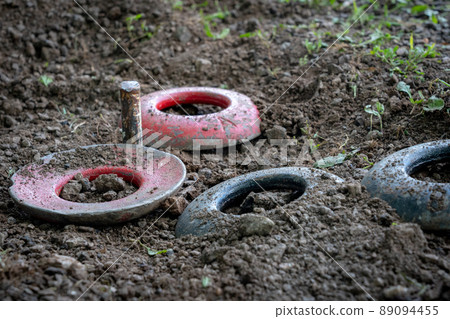 Quoits Resting Around the Peg 89094455