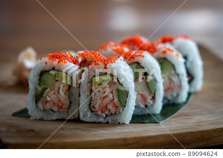 Maki Sushi on a Wooden Plate 89094624
