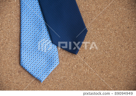 Blue neckties on wooden background. Copy space and idea concept 89094949