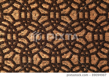 Abstract circular print background on cotton fabric in golden brown tone Abstract circular print background on cotton fabric in golden brown tone 89094987