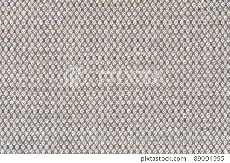 Knitted texture. Texture of jacquard fabric with gray geometric pattern. Crochet mosaic pattern 89094995