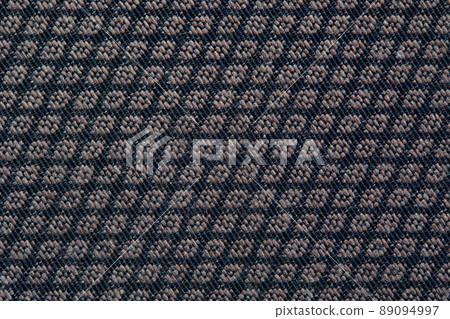 Knitted texture. Texture of jacquard fabric with gray geometric pattern. Crochet mosaic pattern Knitted texture. Texture of jacquard fabric with gray geometric pattern. Crochet mosaic pattern 89094997