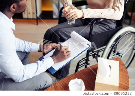 Therapist Talking to Woman in Wheelchair Therapist Talking to Woman in Wheelchair 89095232