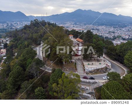 Aerial Drone shot of Church Iglesia de San Cristobalito on the mountain in San Cristobal de Las Casas, Chiapas, Mexico 89095248