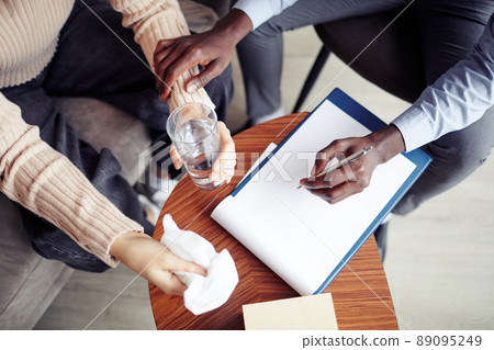 Psychologist Taking Notes During Therapy Psychologist Taking Notes During Therapy 89095249