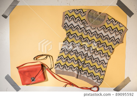 women's patterned sweater, handbag and sunglasses copyspace women's patterned sweater, handbag and sunglasses copyspace 89095592