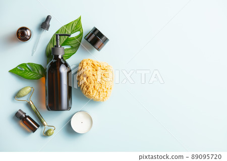 Natural skin care products on blue background, flat lay. 89095720