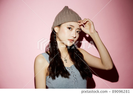 Cool portrait of a young woman in street fashion 89096281