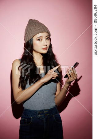 Cool portrait of a young woman in street fashion Cool portrait of a young woman in street fashion 89096294