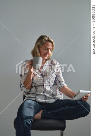 girl with a cup of coffee girl with a cup of coffee 89096335
