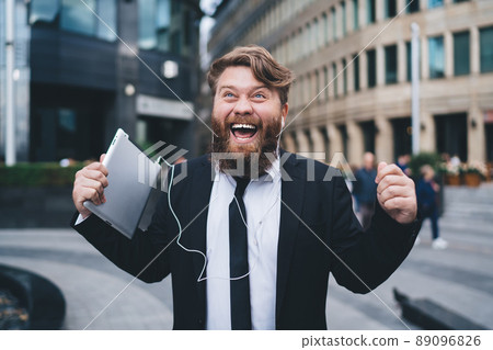 Man screaming with happiness on street 89096826