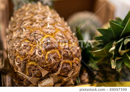 pineapples on the counter in the store 89097399