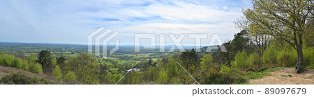 Holmbury Hill, Surrey, UK: Panoramic view from the summit of Holmbury Hill part of the Surrey Hills Area of Outstanding Natural Beauty. View over Surrey countryside towards Pitch Hill and Black Down. Holmbury Hill, Surrey, UK: Panoramic view from the summit of Holmbury Hill part of the Surrey Hills Area of Outstanding Natural Beauty. View over Surrey countryside towards Pitch Hill and Black Down. 89097679