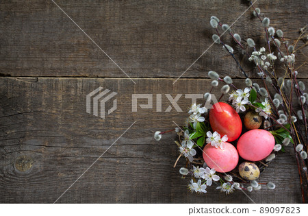 Easter background. Pink  handmade easter eggs in a basket. Top view flat lay background. Copy space. 89097823