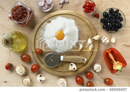 Ingredients for cooking italian pizza on a wooden table 89098097