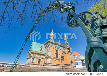 Russian Chapel at Mathildenhoehe Darmstadt seen through a metal floral archway Russian Chapel at Mathildenhoehe Darmstadt seen through a metal floral archway 89098293