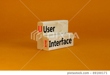 UI user interface symbol. Concept words UI user interface on wooden blocks on beautiful orange table orange background, copy space. Business and UI user interface concept. UI user interface symbol. Concept words UI user interface on wooden blocks on beautiful orange table orange background, copy space. Business and UI user interface concept. 89100171