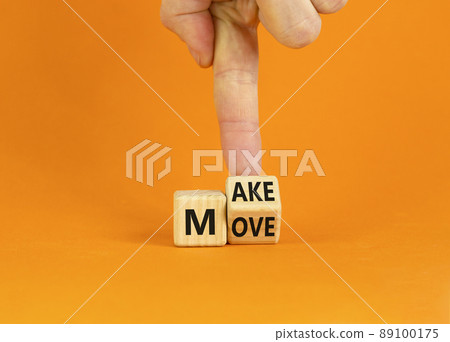 Make your move symbol. Businessman turns the wooden cube with words 'Make move'. Beautiful orange background. Make your move and business concept. Copy space. Make your move symbol. Businessman turns the wooden cube with words 'Make move'. Beautiful orange background. Make your move and business concept. Copy space. 89100175