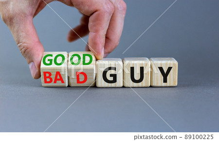 Good or bad guy symbol. Businessman turns cubes and changes concept words Bad guy to Good guy. Beautiful grey background. Business psychological good or bad guy concept. Copy space. Good or bad guy symbol. Businessman turns cubes and changes concept words Bad guy to Good guy. Beautiful grey background. Business psychological good or bad guy concept. Copy space. 89100225