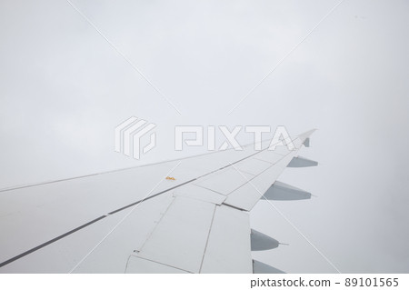 non-flying weather - wing of airplane in the fog non-flying weather - wing of airplane in the fog 89101565