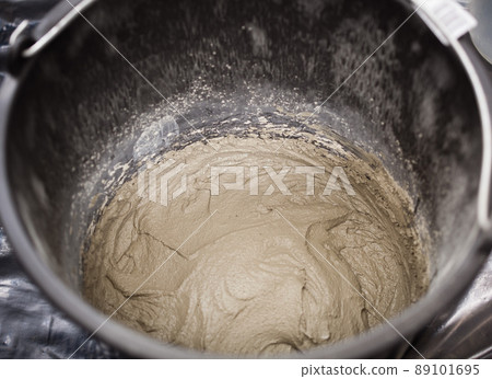 fresh cement in the bucket 89101695