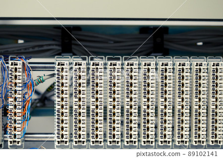 one busy switchboard panel and multitude of empty telephone panels one busy switchboard panel and multitude of empty telephone panels 89102141