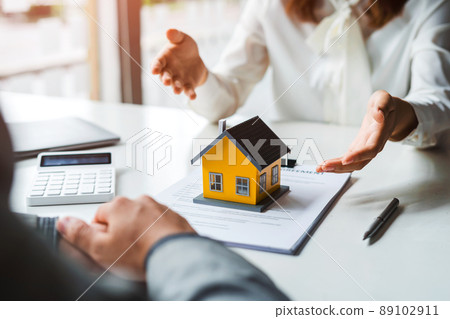 Real estate brokers are offering homes for customers to purchase within their sales offices. 89102911