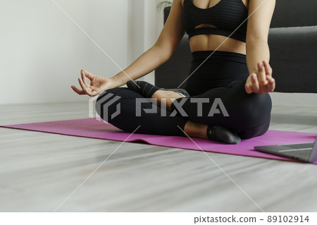 Attractive wellness Asian young woman sit on carpet breathing with yoga lotus pose, Yoga Exercise for Wellness Concept. Attractive wellness Asian young woman sit on carpet breathing with yoga lotus pose, Yoga Exercise for Wellness Concept. 89102914