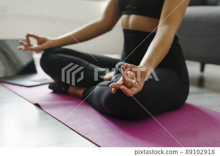 Close up woman wearing sportswear yoga poses for beginner, Lotus pose ( Padmasana). Close up woman wearing sportswear yoga poses for beginner, Lotus pose ( Padmasana). 89102918