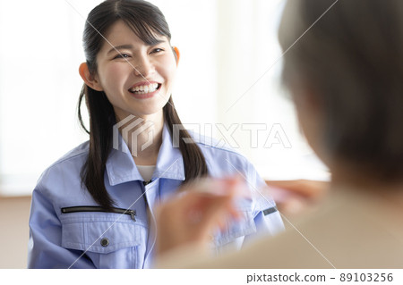 A woman wearing work clothes to have a meeting A woman wearing work clothes to have a meeting 89103256