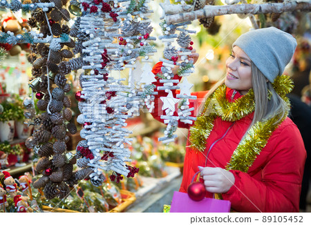 Woman shopping on Christmas market 89105452