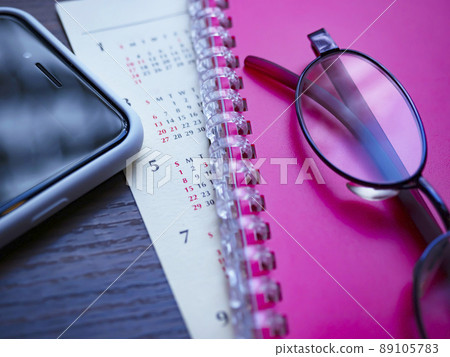 Business image of notebooks, calendars, smartphones, glasses (female) Business image of notebooks, calendars, smartphones, glasses (female) 89105783