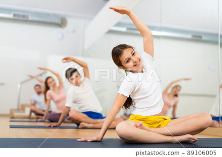 Girl doing lotus pose exercises in gym - Stock Photo [89106005] - PIXTA