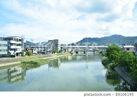 In 2021, the train window from Hiroshima Station on the Sanyo Main Line to Shiraichi Station and the surrounding scenery 89106195