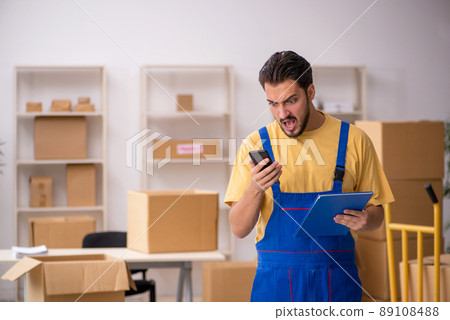 Young male contractor doing home relocation Young male contractor doing home relocation 89108488
