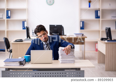 Young male employee working in the office 89109903