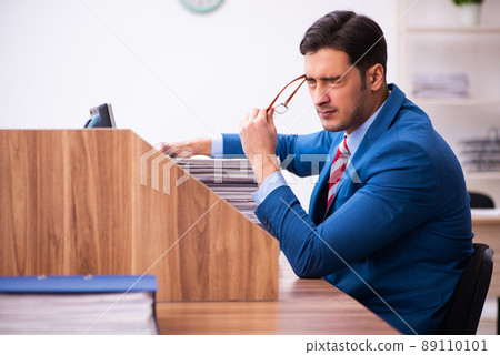 Young businessman employee working in the office 89110101