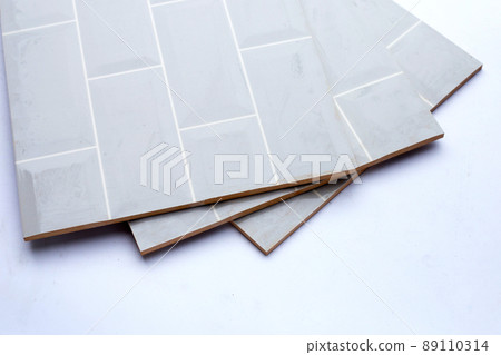 Pile of wall tiles on white background. 89110314