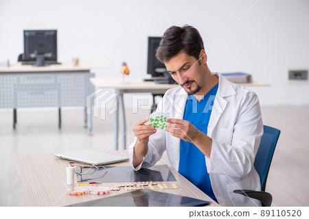 Young male doctor working in the clinic 89110520